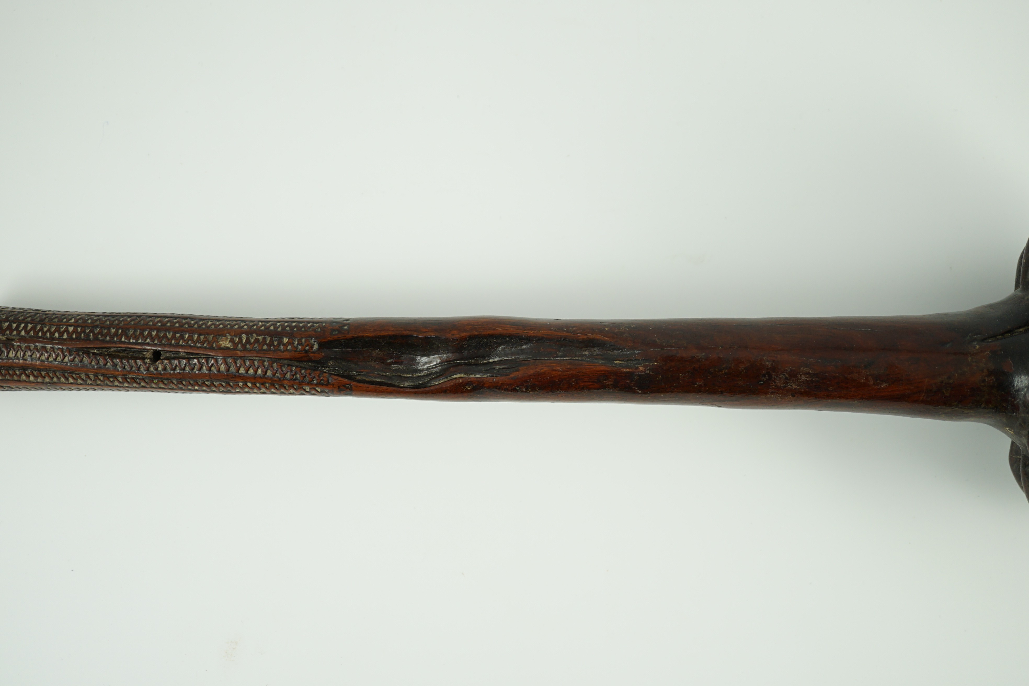 A Fijian hardwood throwing club, 40cm long